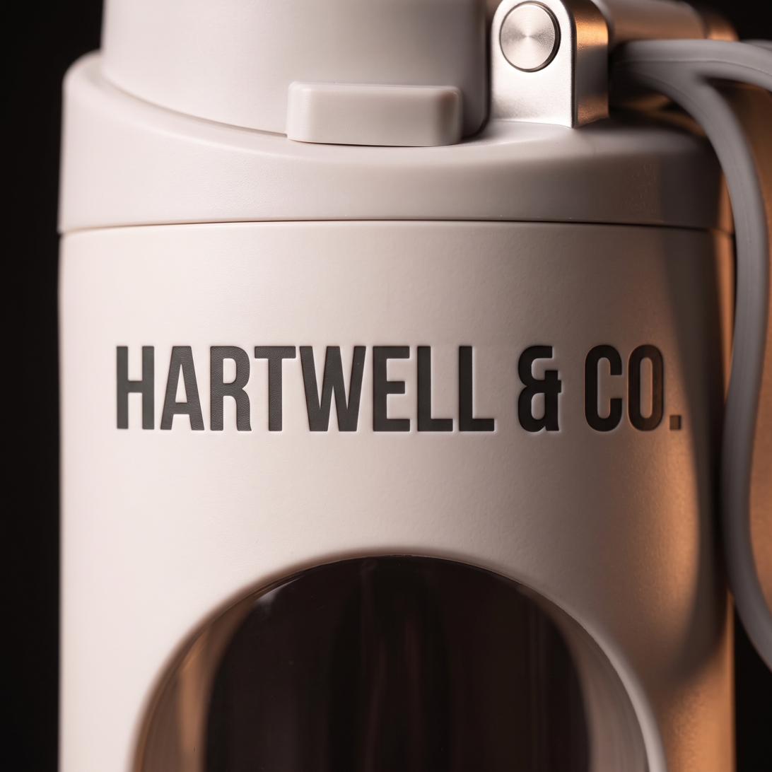 Close-up of the Hartwell & Co. wordmark and brushed-metal detailing